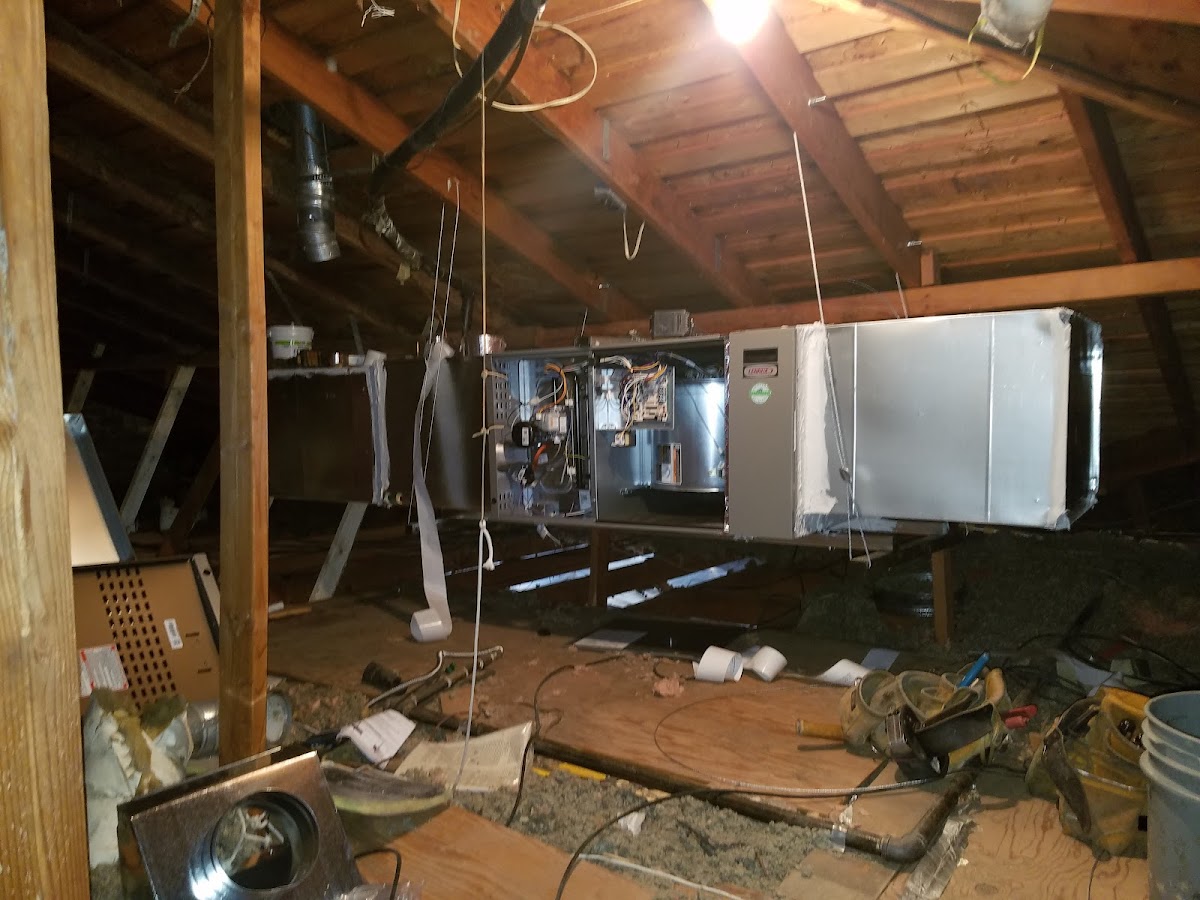 HVAC installation in progress in an attic space